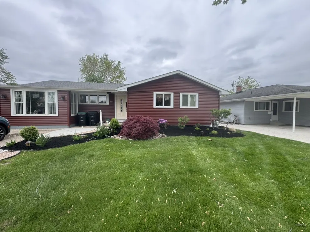 Top-rated landscape installation with custom design in Lockport, NY by Mow & Blow