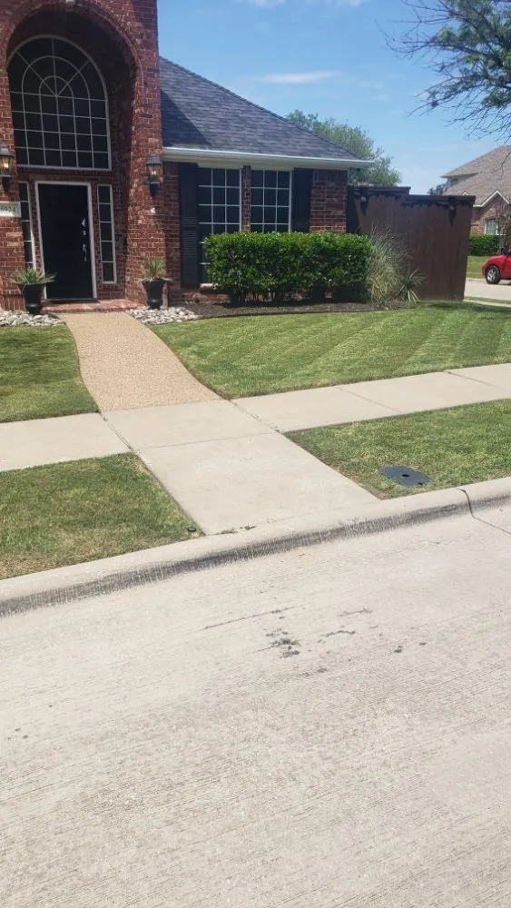 Custom residential landscaping with custom design in The Colony, TX by Mow & More Landscapes