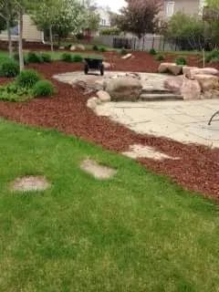Custom landscape installation in Cedar Rapids, IA by Mow Joe Lawn and Landscape
