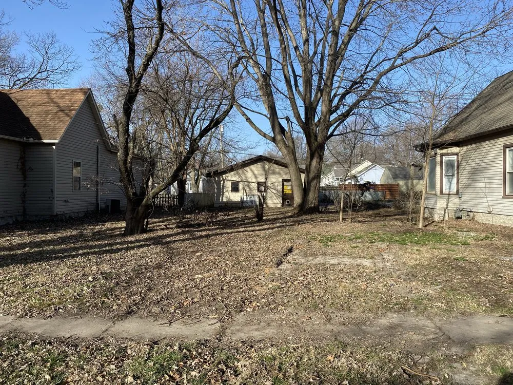 Custom yard cleanup service for residential properties in Topeka, KS by Mow N More