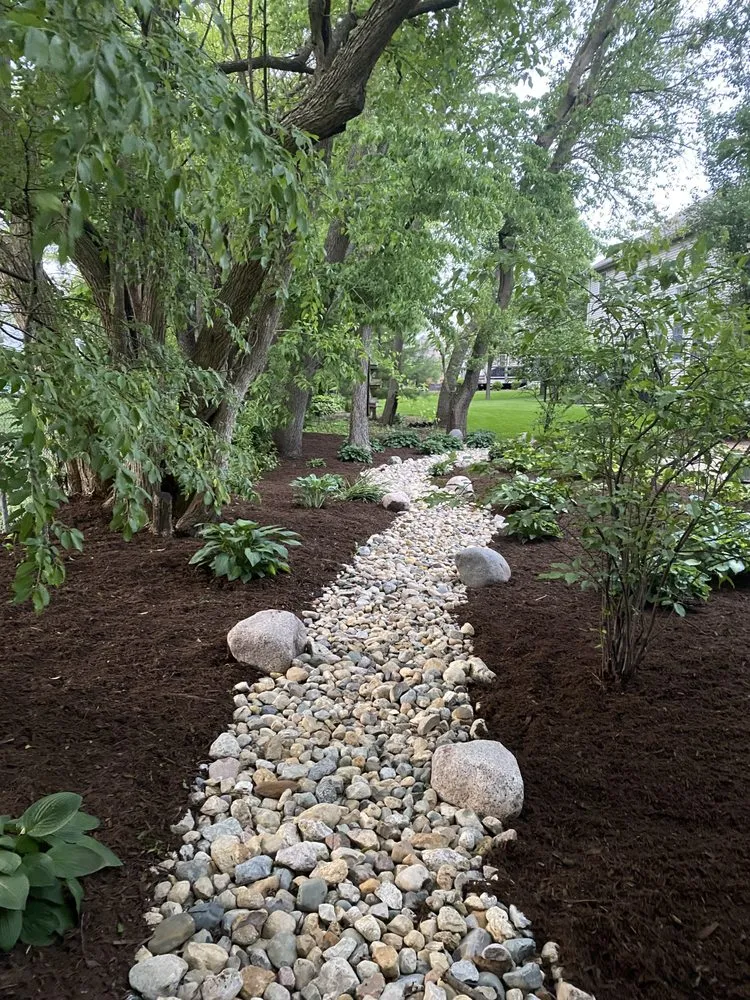 Professional outdoor landscaping in Normal, IL by Mowments Notice