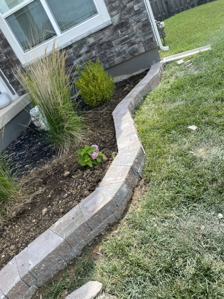 Affordable garden landscaping for year-round maintenance in Grandview, MO by Márquez land care