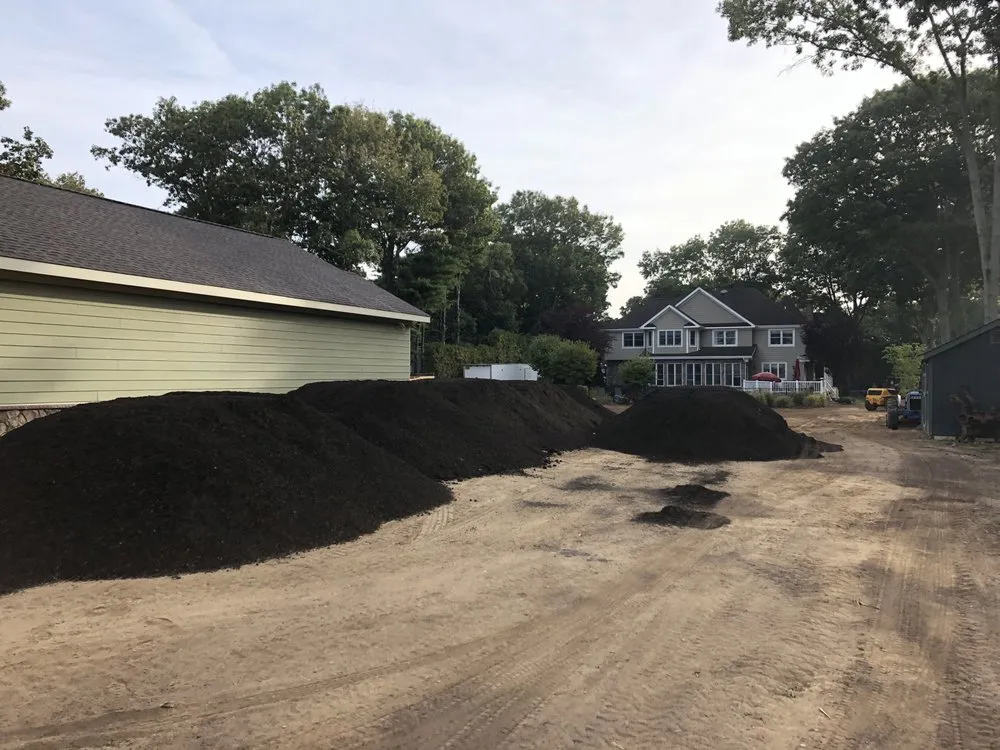 Professional landscaping services for residential properties in Calverton, NY by Mulch Supplier by JB