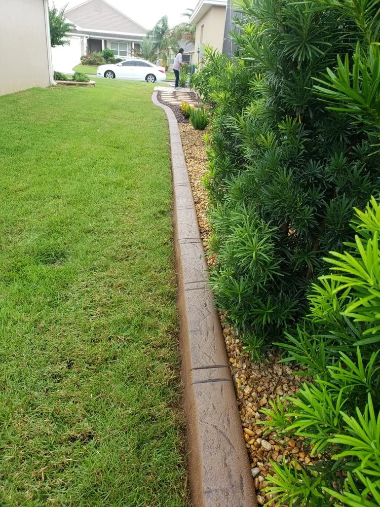 Custom landscape installation in Belleview, FL by Munoz Curbing Landscaping