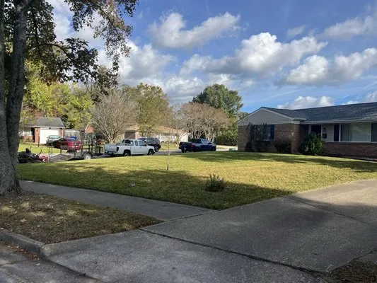 M.W.Cutting Edge Lawn-Care Logo