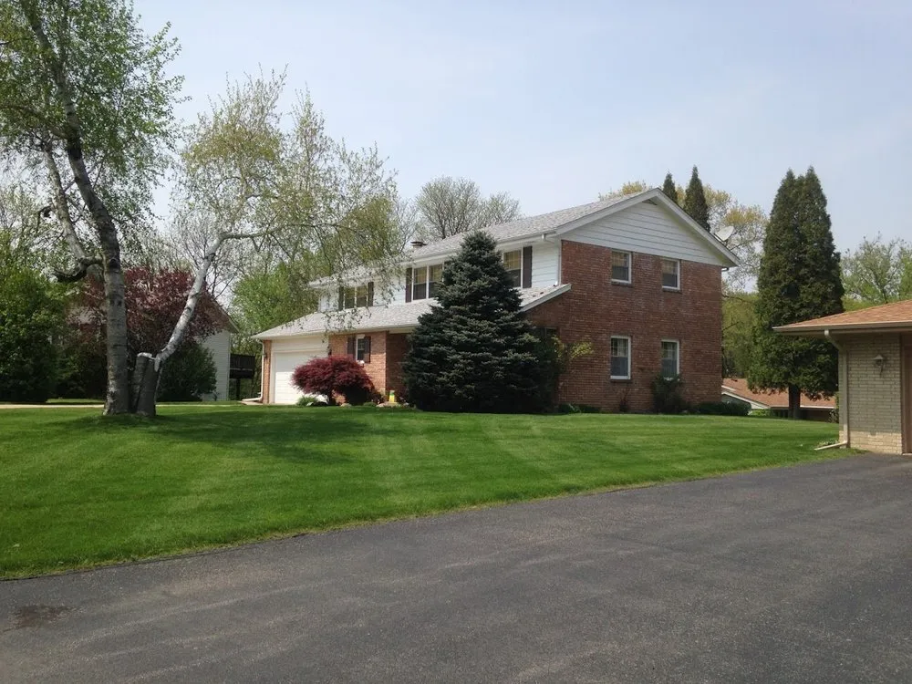 Custom lawn mowing service for residential properties in Machesney Park, IL by Myers Lawn Care