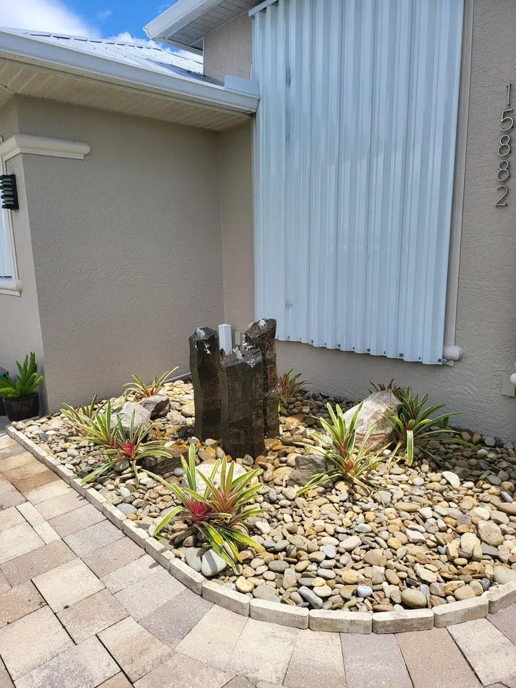 Custom residential landscaping for year-round maintenance in North Port, FL by Mystic Falls & Ponds