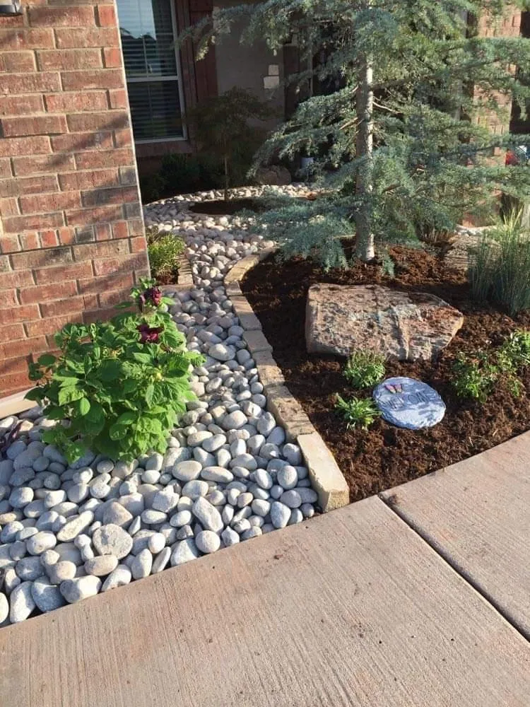 Custom lawn mowing service for year-round maintenance in Edmond, OK by Natural Landscaping