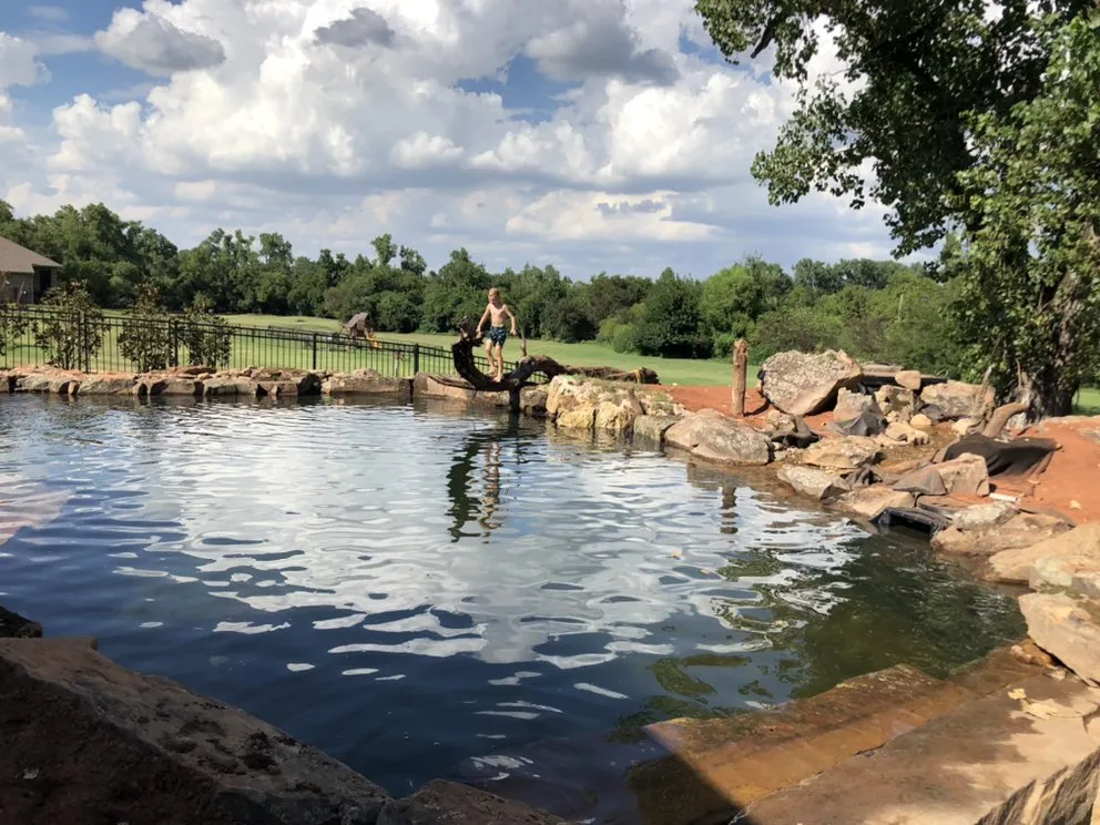 Custom residential landscaping with custom design in Tuttle, OK by Natural Look Water Features