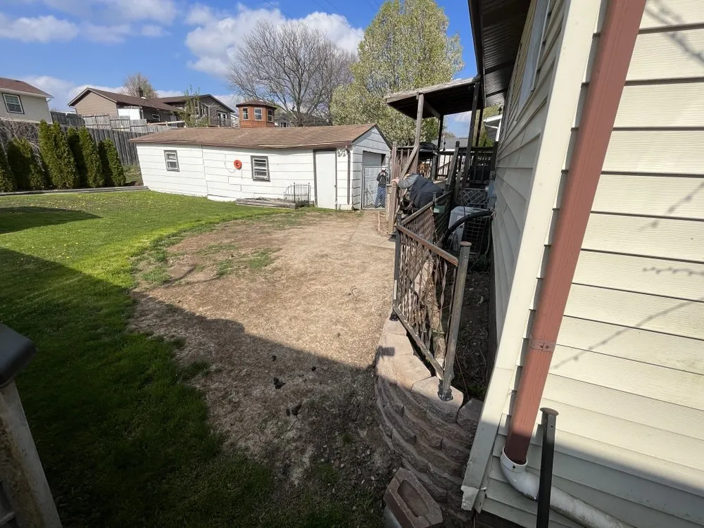 Professional lawn mowing service for residential properties in Davenport, IA by Natural Terrains