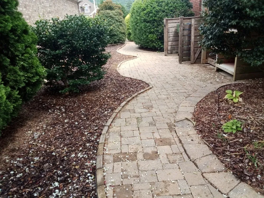 Professional yard cleanup service for residential properties in Huntsville, AL by Nature's Customs