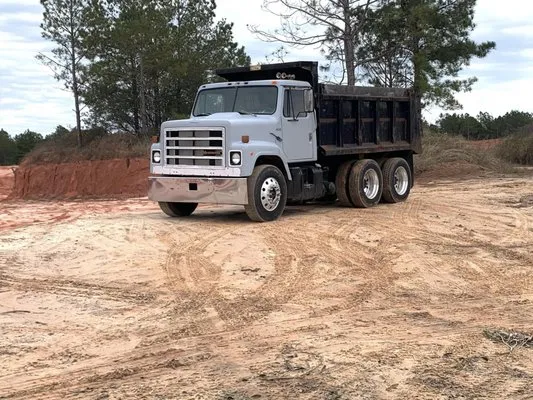 Necaise Hauling And Tractor Work Logo
