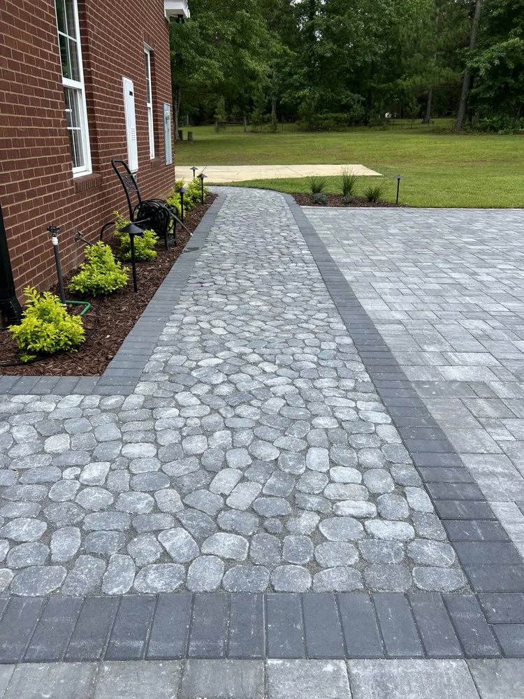 Professional lawn mowing service for outdoor upgrades in Tallahassee, FL by NeSmith Landscapes