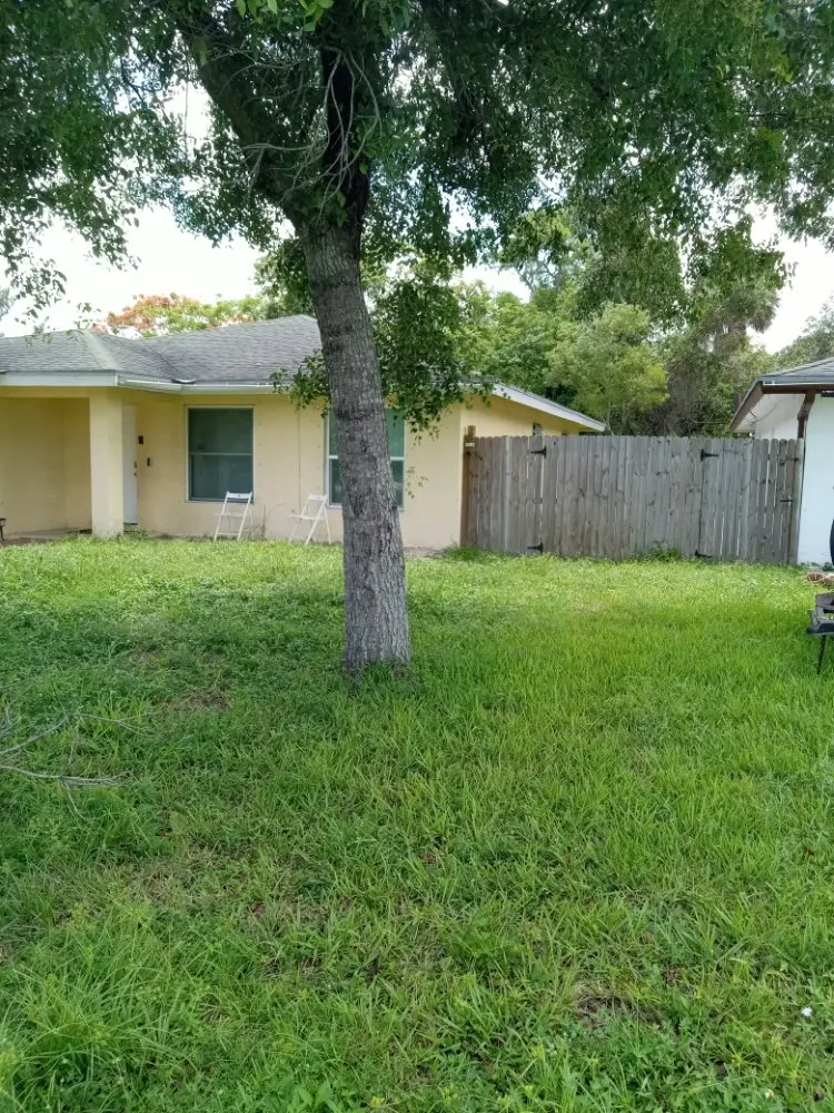 Reliable lawn care service for homes in Lake Park, FL by Never Give Up Enterprise