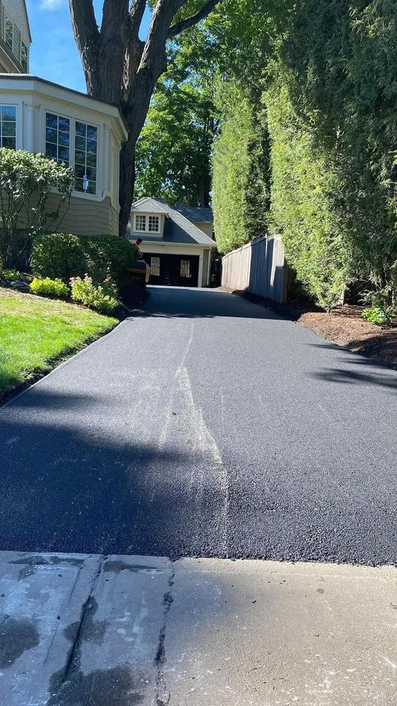 Reliable lawn care service for residential properties in Chelmsford, MA by New England pave works