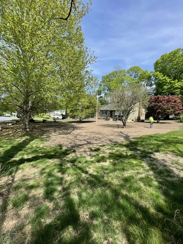 Local landscape installation with custom design in Brentwood, NY by New island services