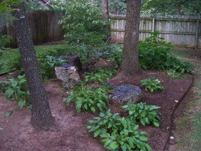 Custom landscape design for outdoor upgrades in Fayetteville, AR by Nichols Reliable Lawn Care and More