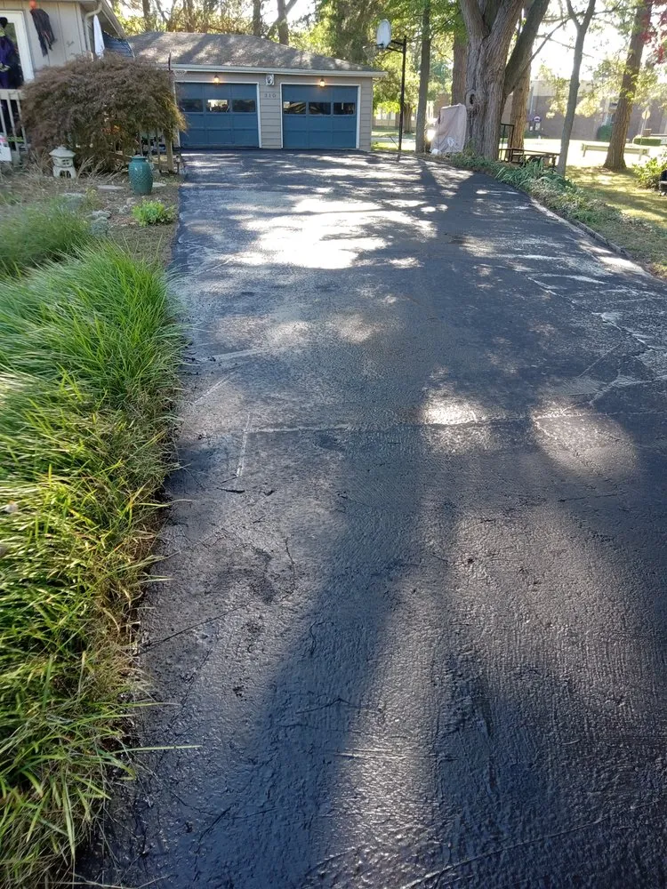 Professional lawn mowing service for year-round maintenance across Flint, MI - Nick and Rae Ann's Lawn Care and Specialties