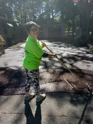 Nick and Rae Ann's Lawn Care and Specialties Logo