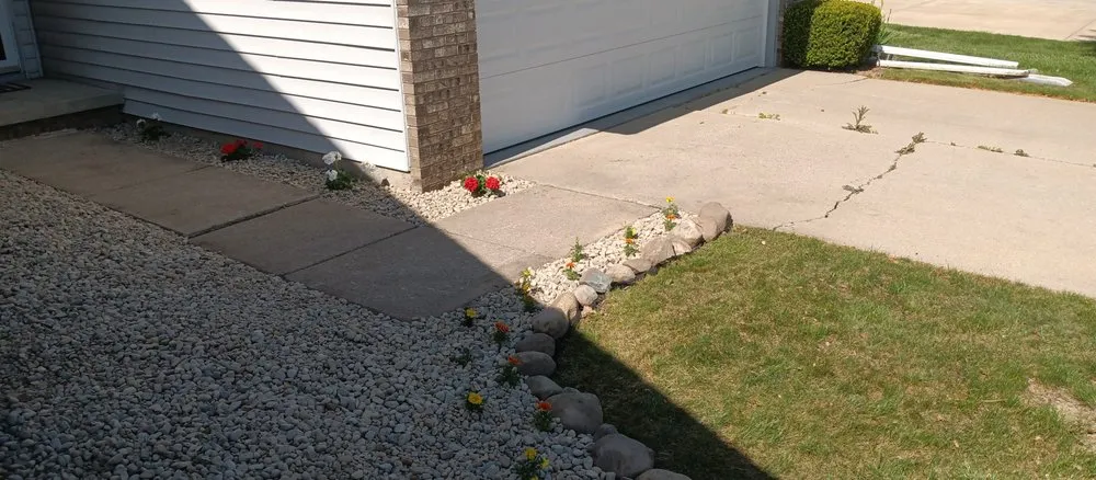 Custom outdoor landscaping with custom design in Flint, MI by Nick's Outdoor services