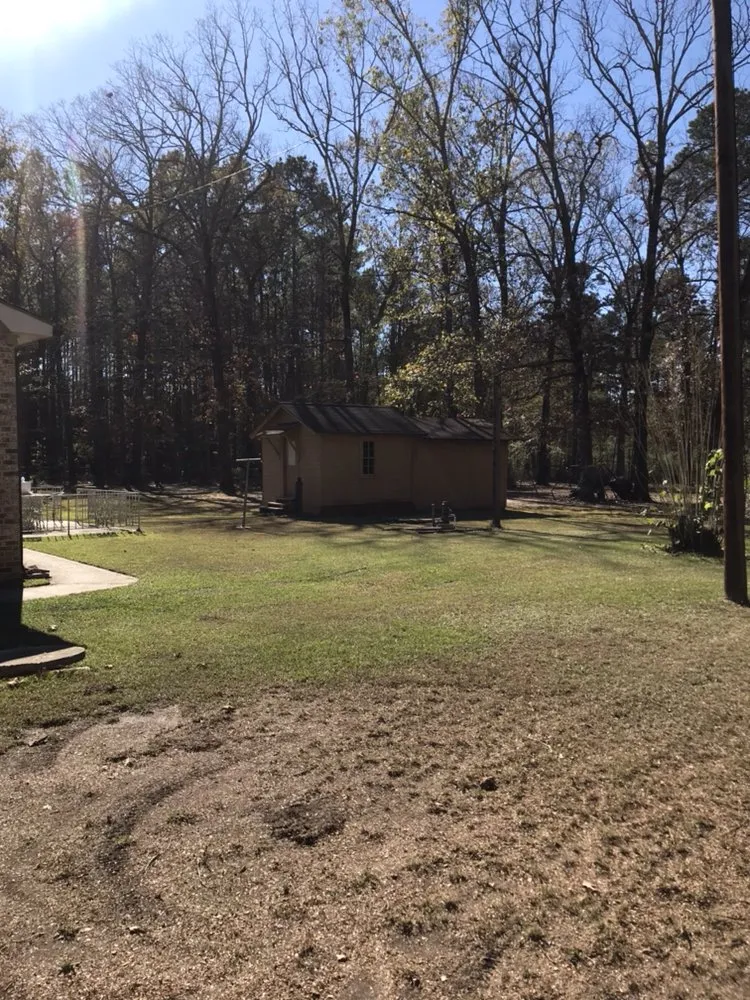 Professional outdoor landscaping with custom design in El Dorado, AR by Nine to Five Lawn Care