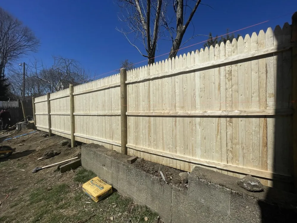 Affordable lawn care service for residential properties in Lynn, MA by Niz Masonry construction & landscaping