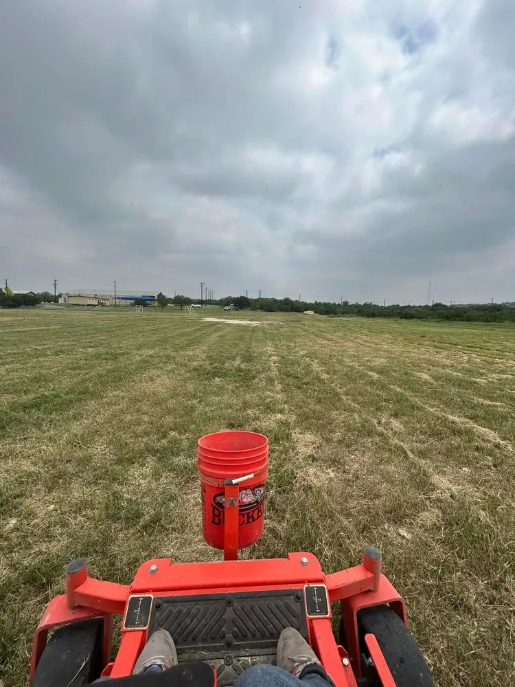 Affordable landscape installation in LaCoste, TX - NJP Cutting Grass