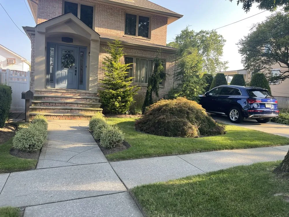 Affordable outdoor landscaping for year-round maintenance in Lindenhurst, NY by Noras Landscaping