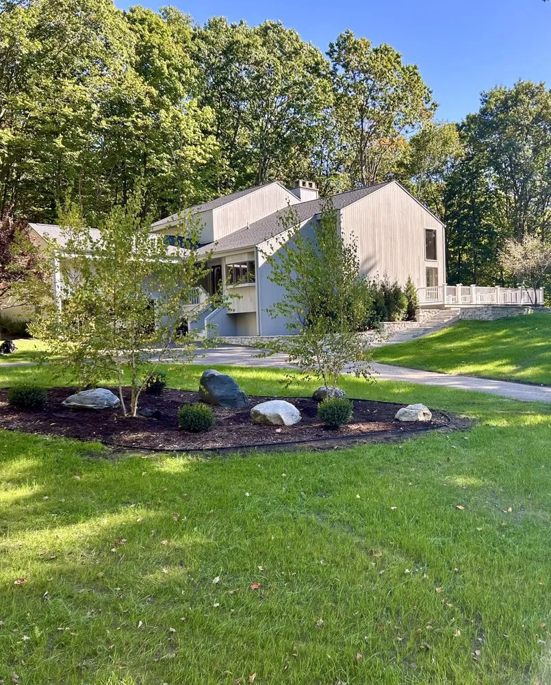 Professional yard cleanup service for residential properties in Harbor Springs, MI by North Wind Property Management