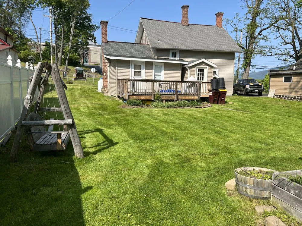 Professional lawn mowing service for year-round maintenance in Greenfield Center, NY by Northeast Property Maintenance