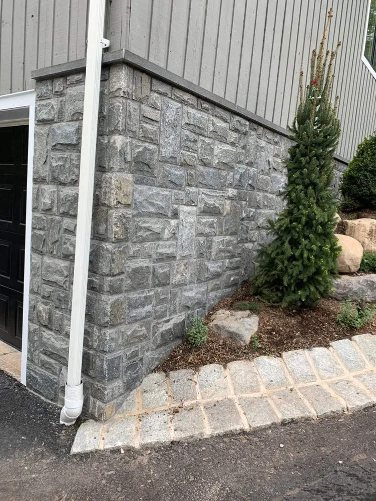 Professional lawn mowing service for outdoor upgrades in Northvale, NJ by Nova Masonry & Landscaping