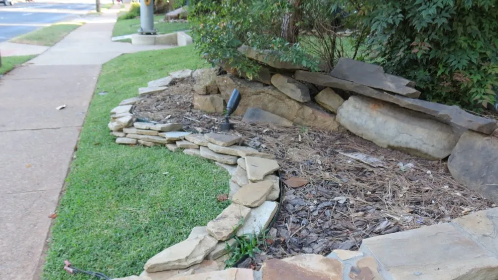 Affordable landscape design for year-round maintenance in Beaumont, TX by Number One Lawn Service