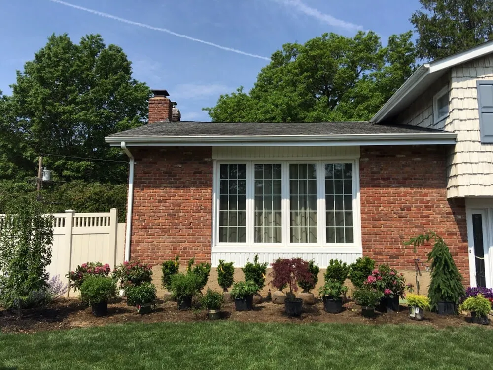Affordable landscaping services with custom design in Glen Cove, NY by Oasis Landscaping