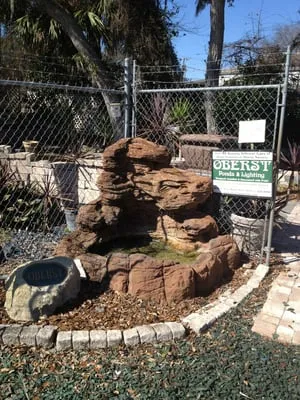 Oberst Landscaping & Lighting Logo