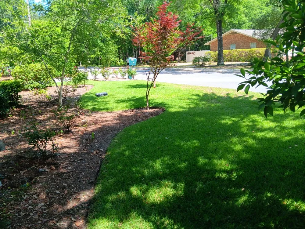 Affordable lawn mowing service with custom design in Niceville, FL by Ohana Quality Services