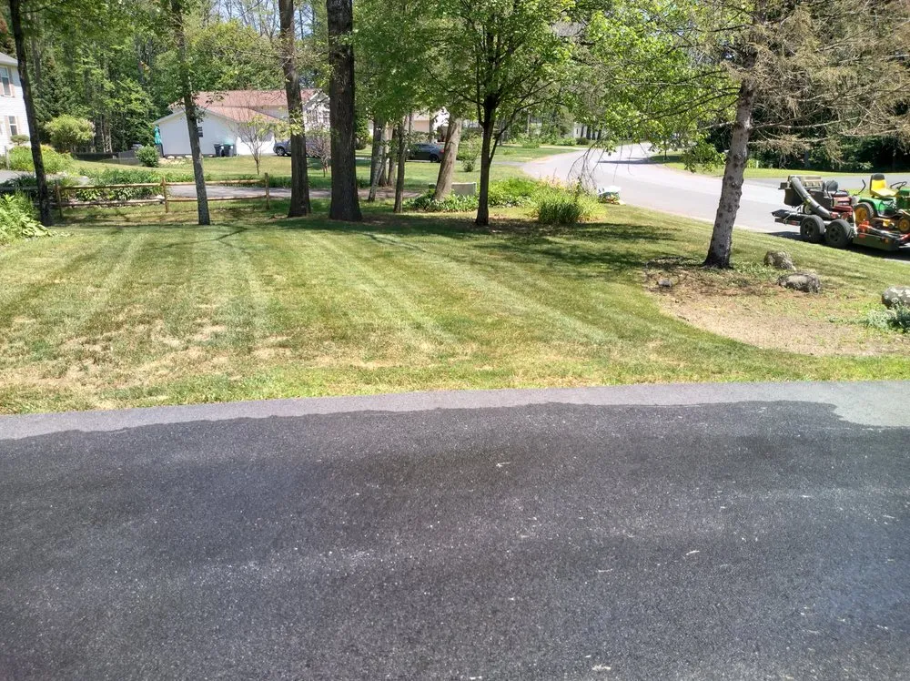 Custom landscape installation for year-round maintenance in Ballston Spa, NY by Old Time Lawn Care
