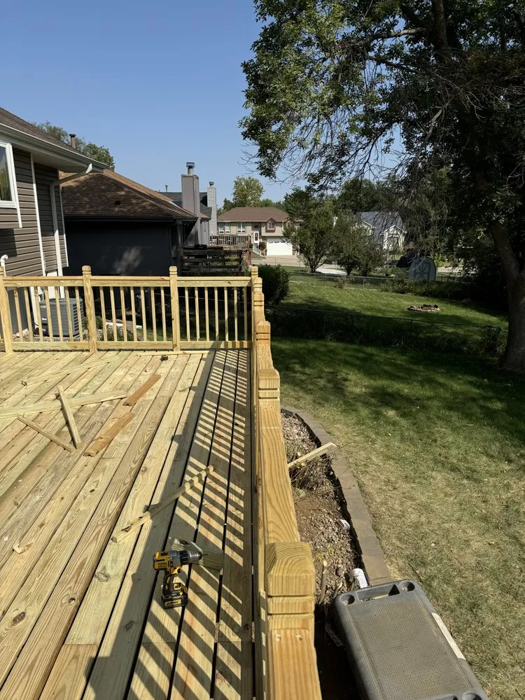 Custom lawn mowing service for homes in Omaha, NE by Olympic Hardscaping and Fencing