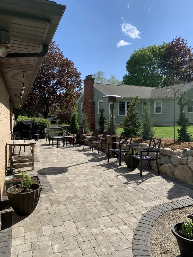 Local lawn mowing service in East Grand Rapids, MI by Omega Brick & Landscaping