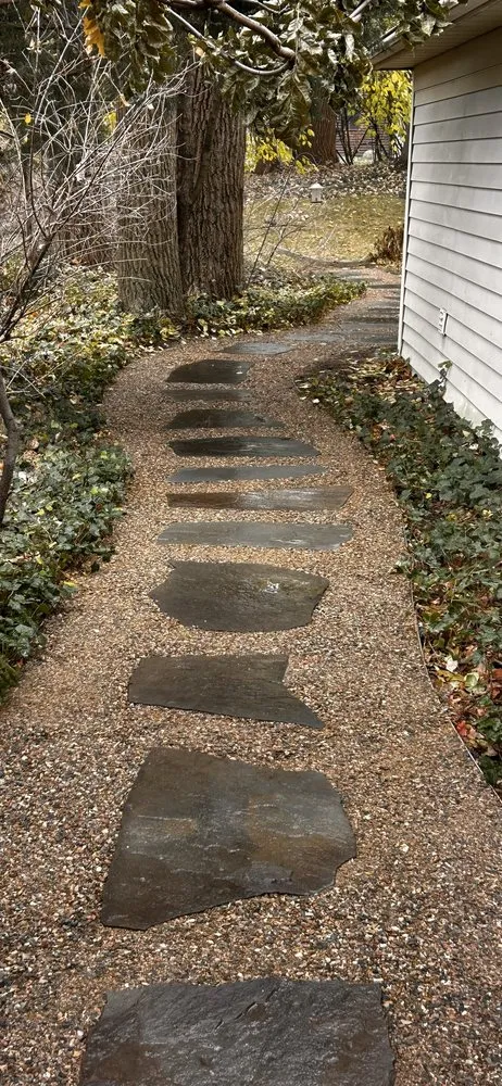 Professional lawn care service for beautiful yards across East Grand Rapids, MI - Omega Brick & Landscaping