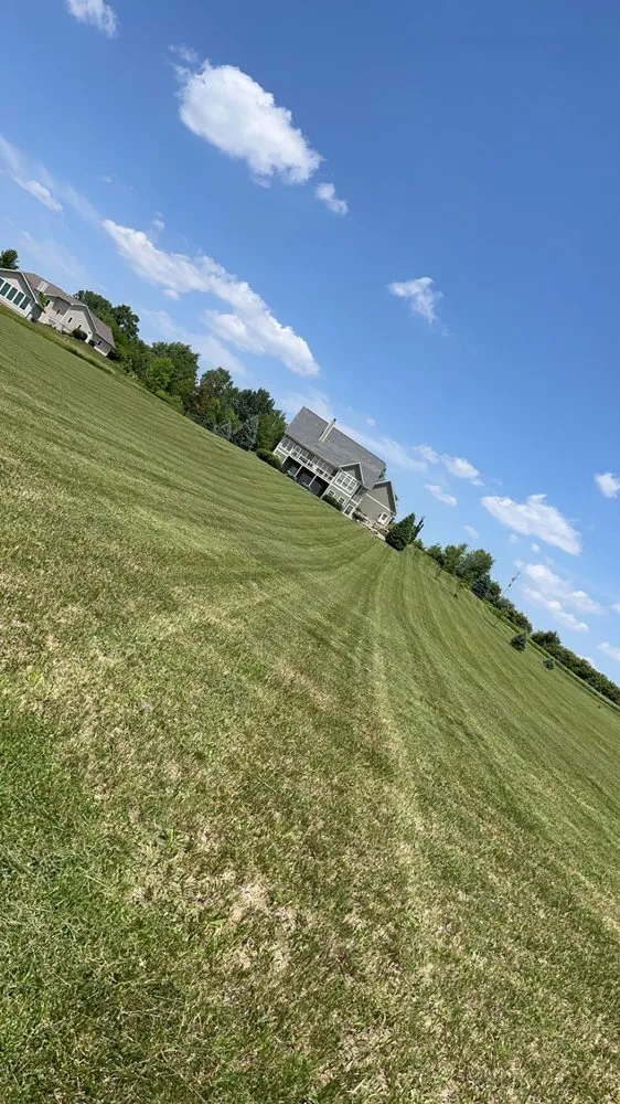 Trusted lawn mowing service for residential properties across Pella, IA - One Bite