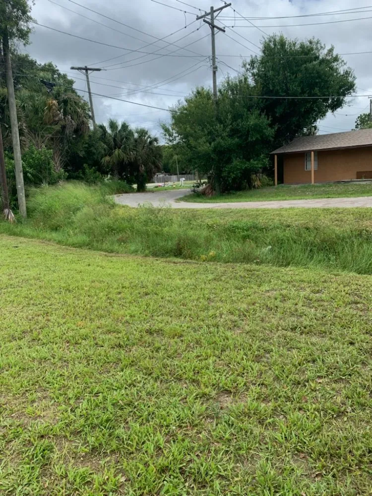 Affordable yard cleanup service for residential properties across Auburndale, FL - One Call Away Lawncare and Landscaping