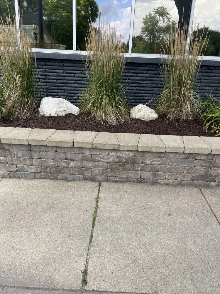 Local yard cleanup service for residential properties in Lansing, MI by One Cut