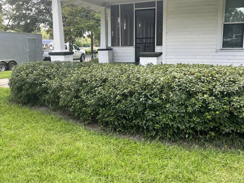 Custom outdoor landscaping with custom design in Twin City, GA by One of a Kind Lawn Care and Tree Services