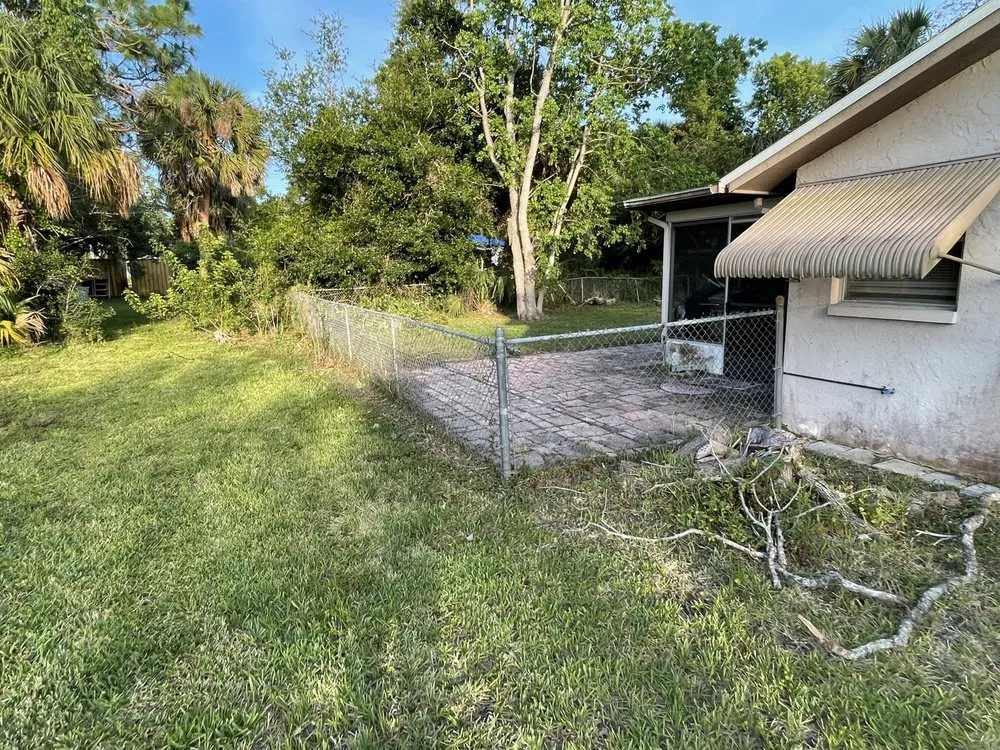 Professional yard cleanup service with custom design in Ruskin, FL by Optimum Lawn Care Services