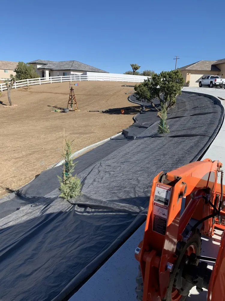 Professional yard maintenance with custom design across Victorville, CA - Orange Stone Concrete & Landscaping