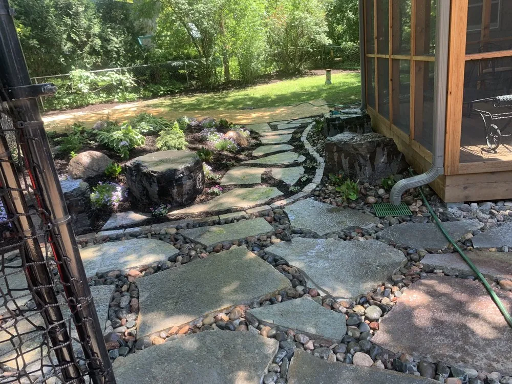 Custom yard cleanup service for year-round maintenance in Bloomington, MN by Organic Lawns by Lunseth