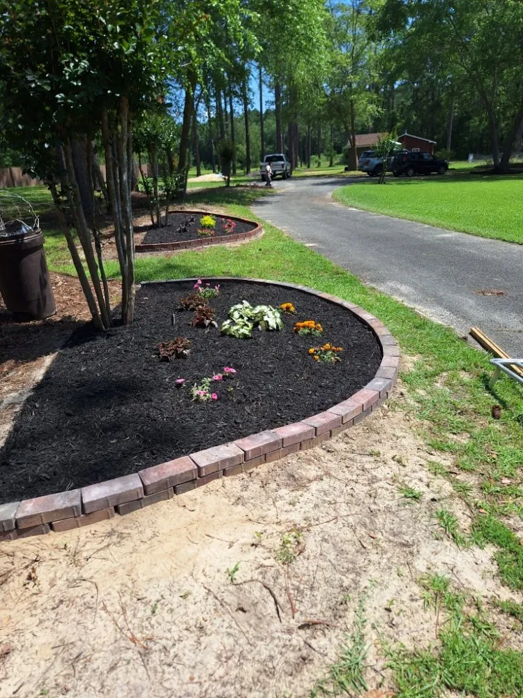 Professional garden landscaping with custom design in Adel, GA by Oshis Lawn Care