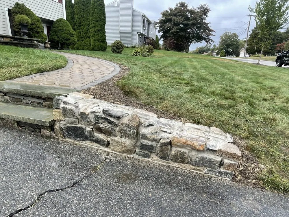 Expert lawn care service experts serving Bristol, RI - Ouellette Landscape & Design