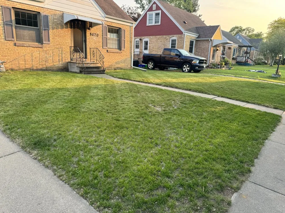 Local landscape design with custom design in Elk Mound, WI by Our Family Lawn Care