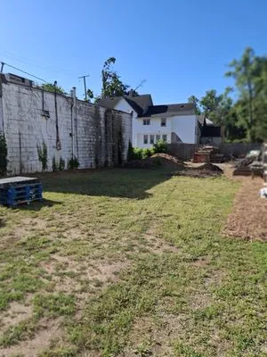 Out 2 Earth Landscaping and Earth Services Logo